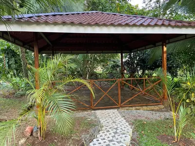 a pavilion with a bridge in a garden at Serenity in Fortuna