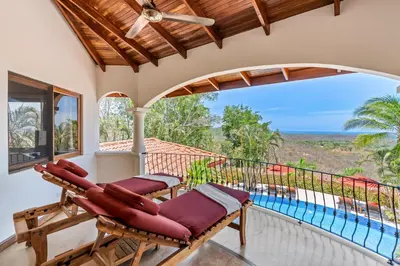 a balcony with a view of the ocean at Los Altos de Eros - Adults Only in Playa Avellana