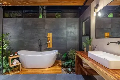 a bathroom with a large tub and a sink at The L Design Villa in Carmen