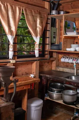 a kitchen with a sink and a window at Cabaña Ave Del Paraiso in Cartago