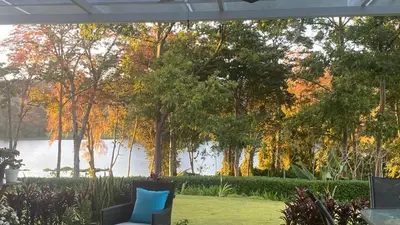 a patio with a view of a lake and trees at CASA DEL LAGO in Cachí