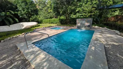 a swimming pool in a yard with a skate park at Casa Coco Playa Marbella with AC, Swimming Pool, Skate Bowl & walking distance Beach for Surfers and Nature Lovers in Marbella