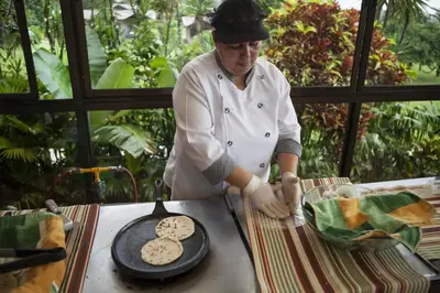 a chef preparing cookies on top of a table at Hotel Arenal Springs Resort & Spa in Fortuna