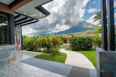 a house with a view of a mountain at Hotel Arenal Springs Resort & Spa in Fortuna