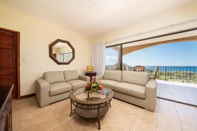 a living room with a couch and a table at Vida de la Paz 4 - Oceanview Condo, 2BR, just remodeled, Playa Prieta in Potrero