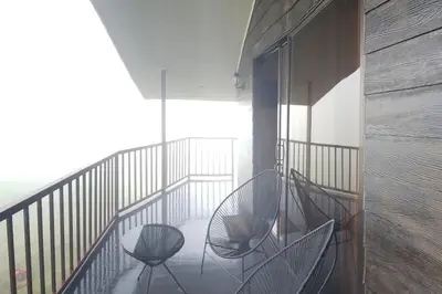two chairs sitting on top of a balcony at Cabaña Montaña de Sueños in Quesada