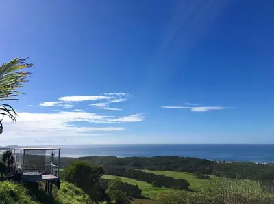 a view of the ocean from the top of a hill at La Colina Pura Vista in Bejuco