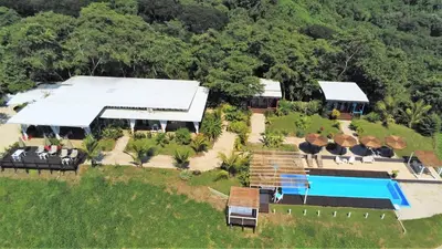 an aerial view of a resort with a swimming pool at La Colina Pura Vista in Bejuco