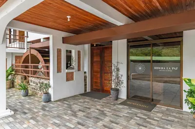 a front door of a house with a wooden ceiling at Hotel Ribera La Paz in San Ramón