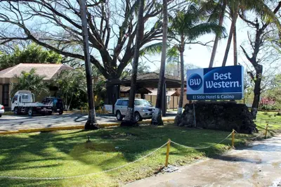 a best western sign in front of a house at Best Western El Sitio Hotel in Liberia