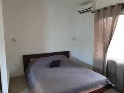 a bedroom with a bed in a room with a window at Apart Hotel Marina Loft 214 in Coco