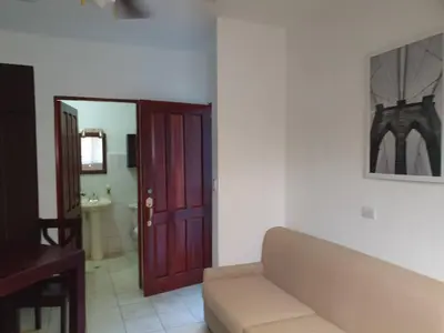 a living room with a couch and a bathroom at Apart Hotel Marina Loft 214 in Coco