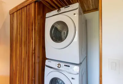 a washer and dryer stacked on top of each other at La Joya de Nosara in Playa Pelada