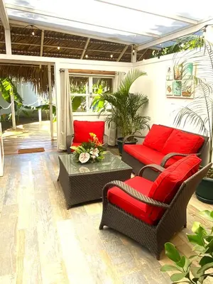 a living room with two chairs and a table at Buendía Lux Piña Suite Hidden Gem Near Beach with Pool in Potrero