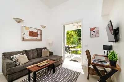 a living room with a couch and a table at Buendía Lux Piña Suite Hidden Gem Near Beach with Pool in Potrero
