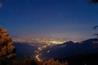 a view of a city at night from a mountain at Cabaña la Chispita, Alto Jaular in Rivas