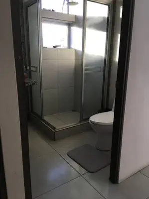 a bathroom with a shower and a toilet at Casa céntrica en San Ramón in San Ramón