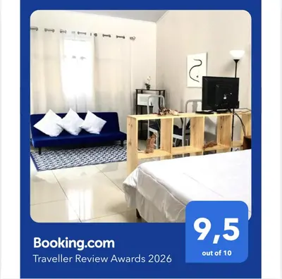 a room with a bed and a couch and a tv at Apartamentos Sacor #1 Studio in Curridabat