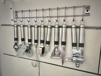 a bunch of kitchen utensils hanging on a wall at Apartamentos Sacor #1 Studio in Curridabat