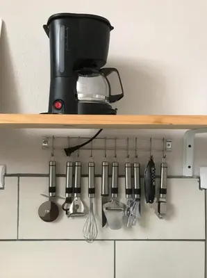 a shelf with a bunch of kitchen utensils at Apartamentos Sacor #1 Studio in Curridabat