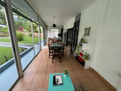 a room with a table and chairs and a dining room at Casa Willow Spacious and relaxing property in Ojochal