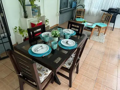 a dining room table with blue plates on it at Casa Willow Spacious and relaxing property in Ojochal