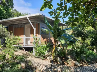 a small house in the middle of a garden at Nangu lodge in Sámara