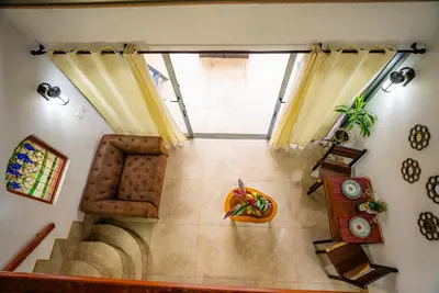 an overhead view of a staircase in a living room at Tortuga Premium Riverfront Jungle Villa with Jacuzzi and Pool in Uvita