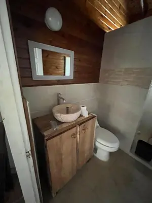 a bathroom with a sink and a toilet at Quinta Esencia in Brasilito