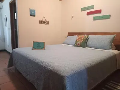 a bedroom with a bed with a box on it at Quinta Esencia in Brasilito