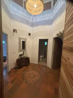 a large hallway with a chandelier and a room at Quinta Esencia in Brasilito