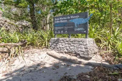 a sign for a bird park with a blue bird on it at Surfside Apartments - Mal Pais in Mal País
