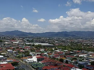 a view of a city with buildings and mountains at Secrt 1914 in San José