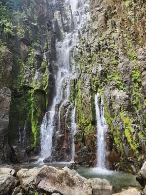 a waterfall on the side of a mountain at Bed and breakfast Bachelor in Sagrada Familia