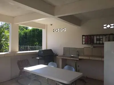 a kitchen with a table and chairs and a window at Bed and breakfast Bachelor in Sagrada Familia
