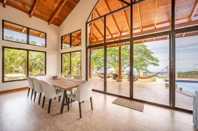 a dining room with a wooden table and chairs at Casa Carrillo in Buenos Aires