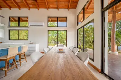 a large dining room with a wooden table and chairs at Casa Carrillo in Buenos Aires