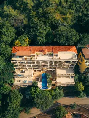 an overhead view of a building with a blue roof at Oceanview Rancho with Two bedroom & Two baths in Coco