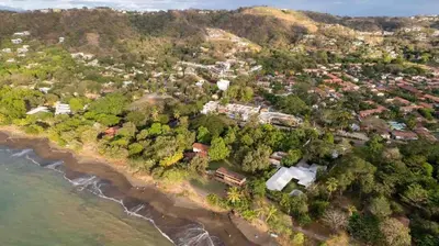 an aerial view of a village on a beach at Coco Dream Escapes Ground unit in Coco