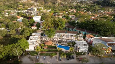an aerial view of a house with a pool at High Tide 2 bed1 bath condo Terrace in Coco