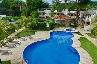 an image of a swimming pool at a resort at High Tide 2 bed1 bath condo Terrace in Coco