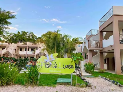 a sign in front of a building at EndlessSummer Beach Escape in Coco