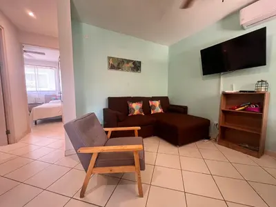 a living room with a couch and a chair at EndlessSummer Beach Escape in Coco