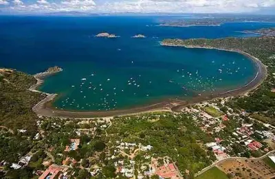an aerial view of a beach with boats in the water at Discounted - PuraVida Escape and rooftop terrace in Coco