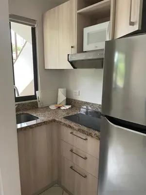 a kitchen with a stainless steel refrigerator and a sink at Discounted - Beach Dreams Coco Ground Floor Unit in Coco