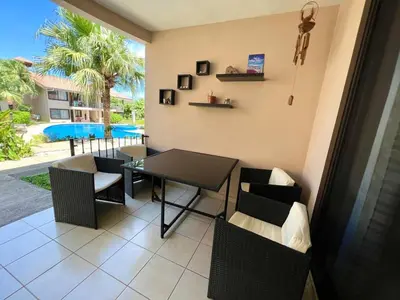 a dining room with a table and chairs at Sea Bottom Ground Condo in Coco