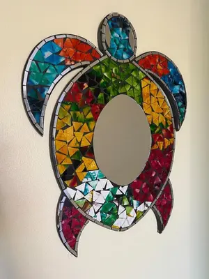 a stained glass rabbit ornament on a wall at Sea Bottom Ground Condo in Coco
