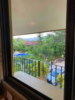 a view of a swimming pool from a window at Cabaña en el Sol Cabin in the Sun in Ocotal