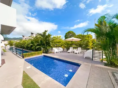 an image of a swimming pool in a villa at Pura Vida Apartment with nice pool walking distance to the heart of Jaco in Jacó