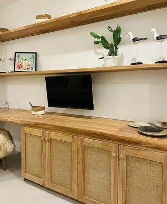 a television on a wooden counter in a room at Las Guapas Villas Tamarindo in Tamarindo